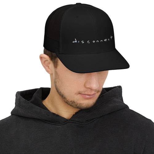 Person wearing a black cap with 'disconnect' text on a white background
