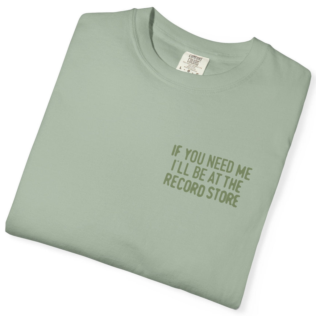 Folded light green t-shirt with text on a white background