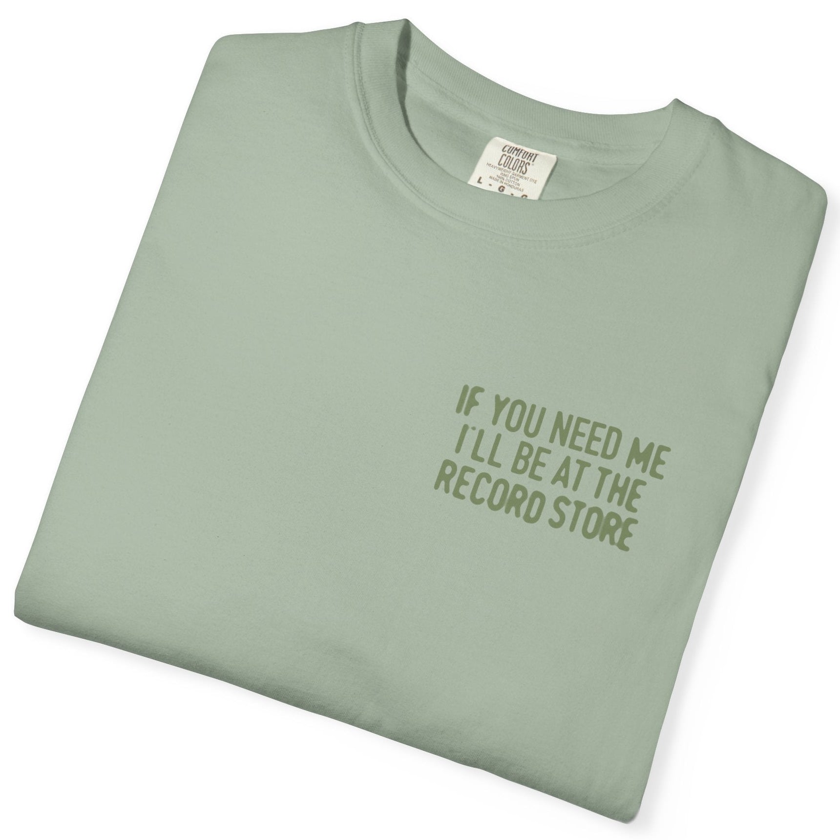 Folded light green t-shirt with text on a white background