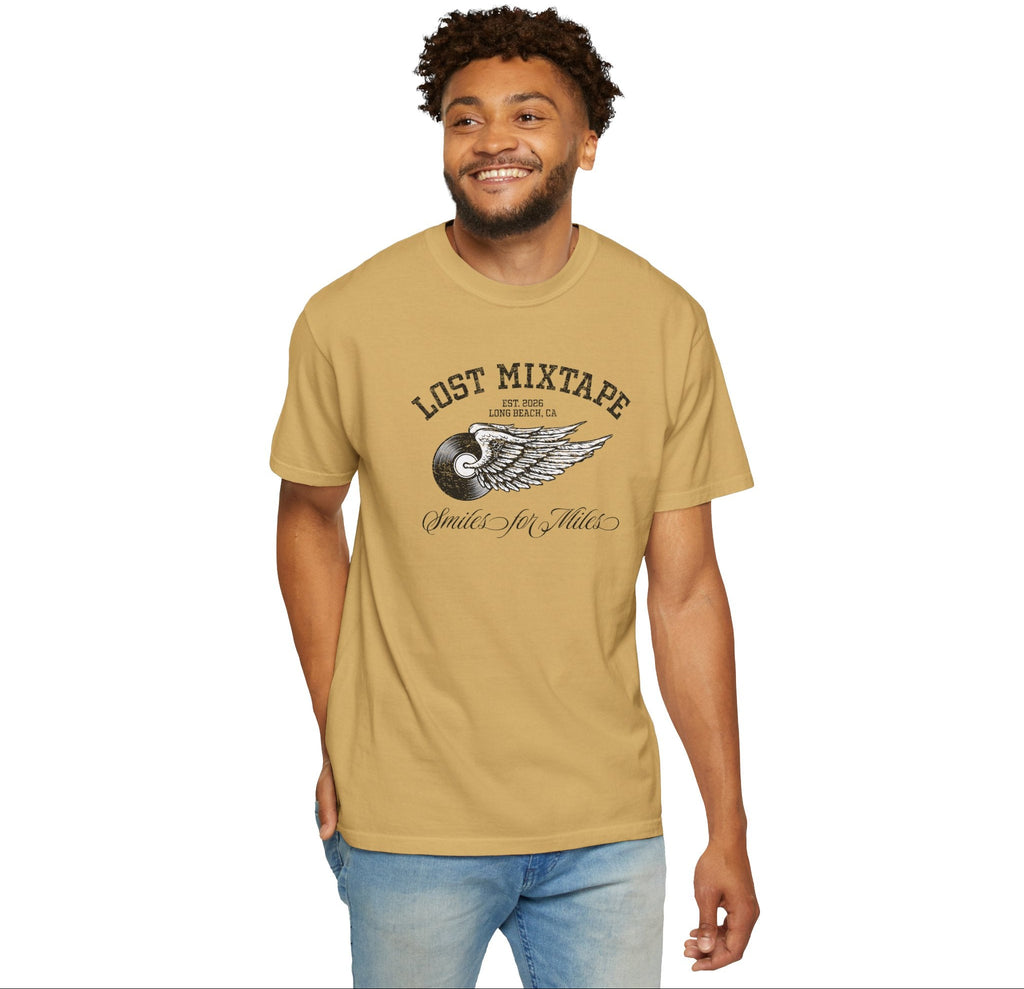 Man wearing a tan t-shirt with 'Lost Mixtape' design on a white background
