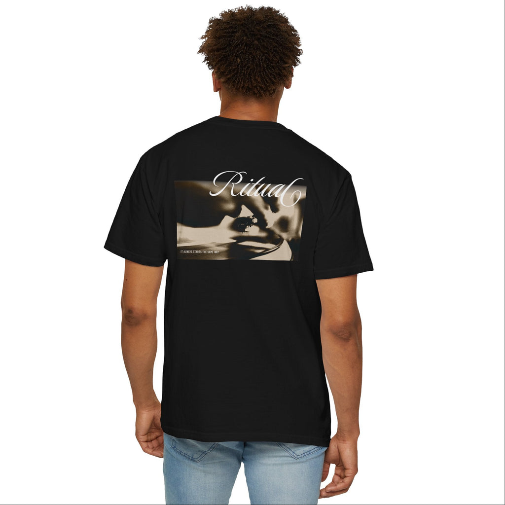 Man wearing a black t-shirt with 'Ritual' design on the back, standing against a white background