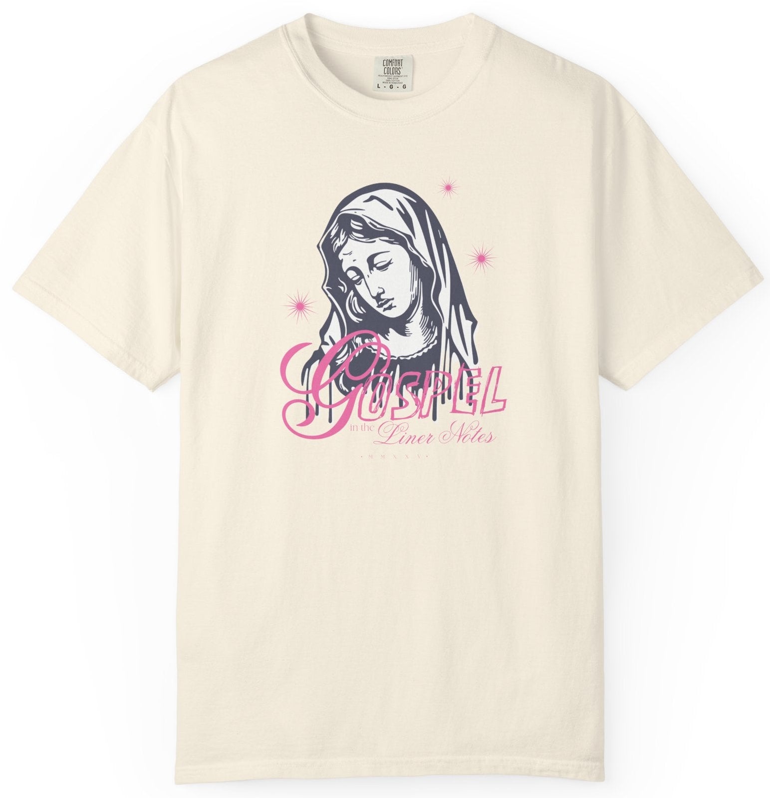 Beige t-shirt with a graphic design of a face and text on a white background