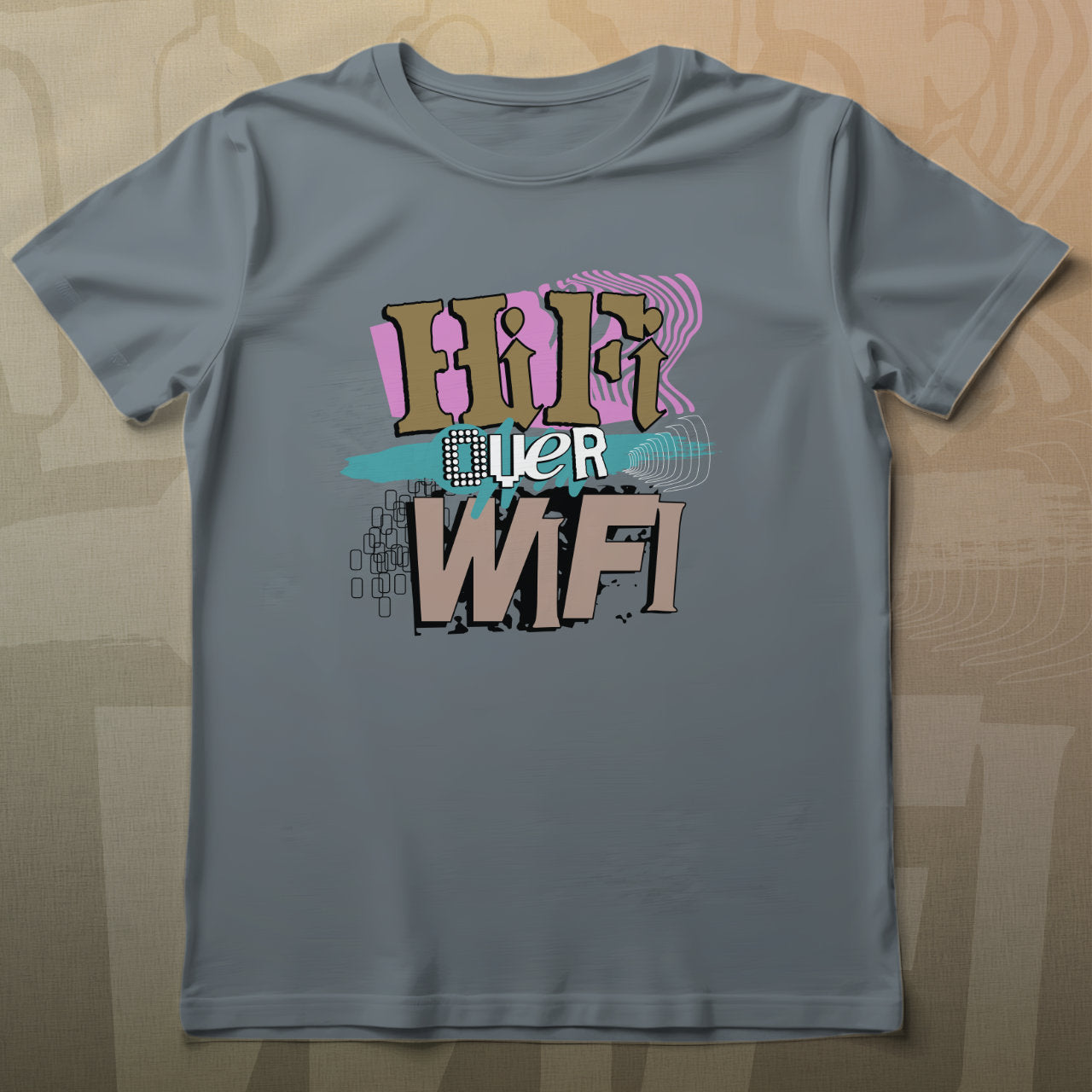 Gray t-shirt with colorful graphic design on a wooden surface