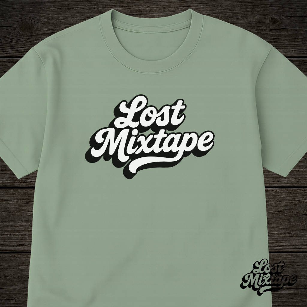 Green t-shirt with 'Lost Mixtape' text on a wooden surface