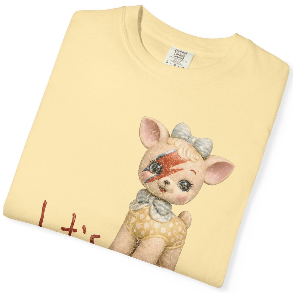 Folded yellow t-shirt with a cartoon pig design on a white background